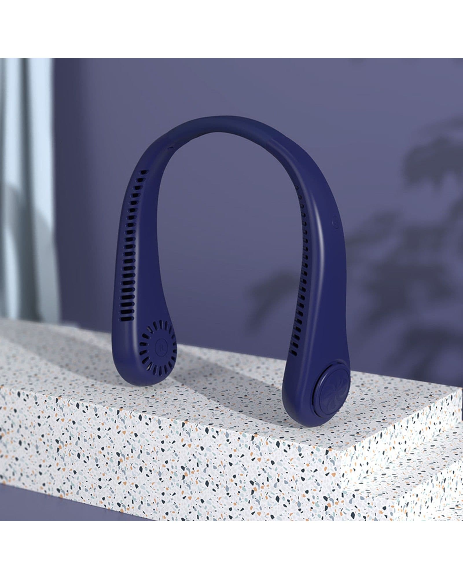 A dark blue Airbro FNE-100 wearable neck fan resting on a speckled stone surface against a purple background.