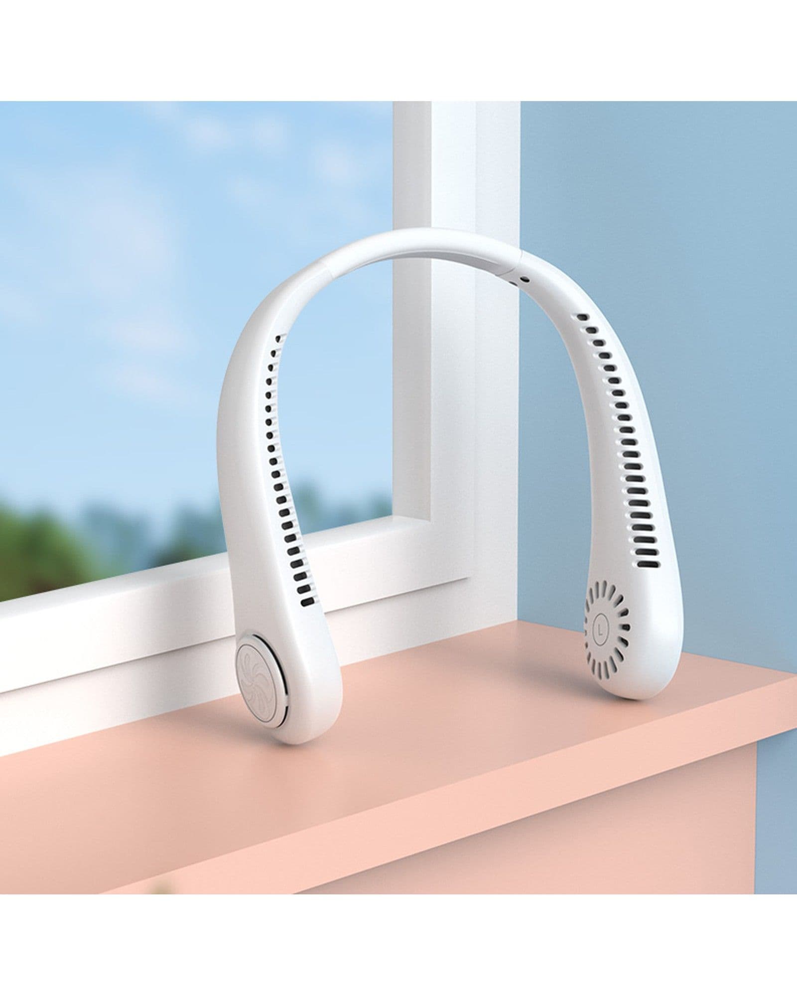 A white Airbro FNE-100 wearable neck fan resting on a pink windowsill in front of a window.