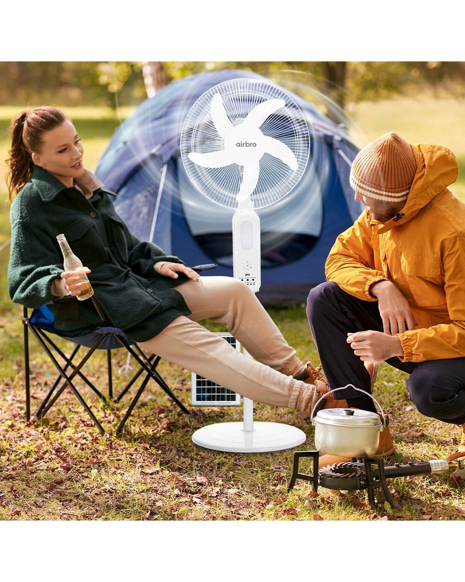An Airbro FSA-160 pedestal fan cooling a couple camping in front of a blue tent.