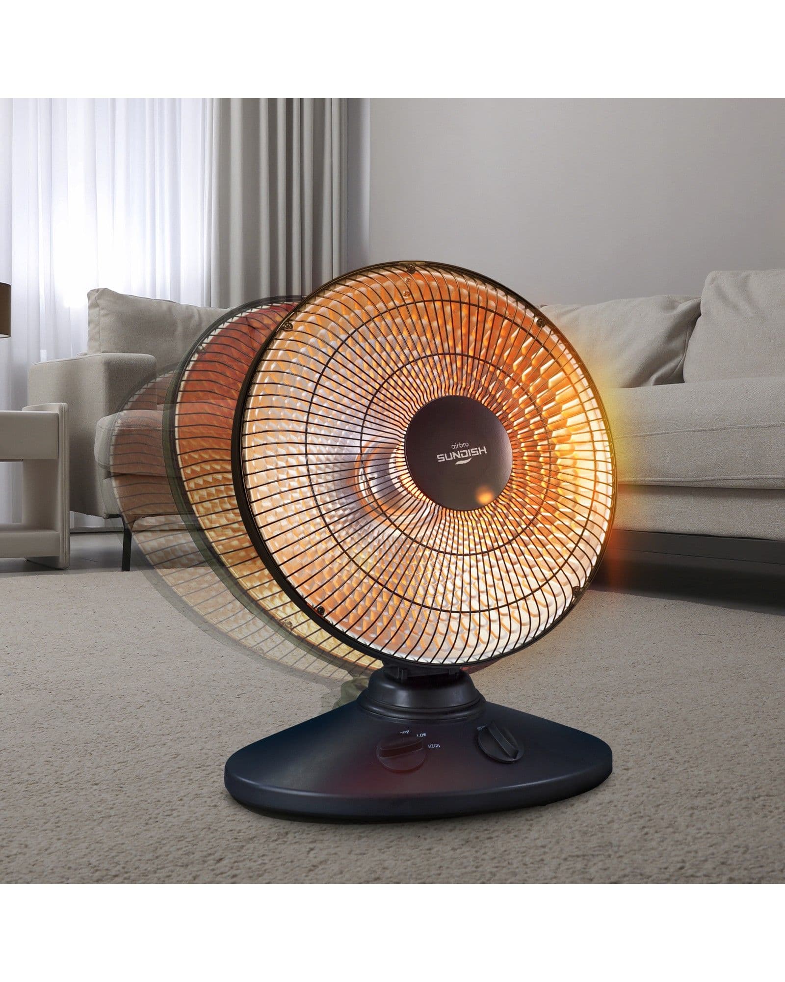 An Airbro HP-1000 oscillating electric heater glowing orange in a living room setting.